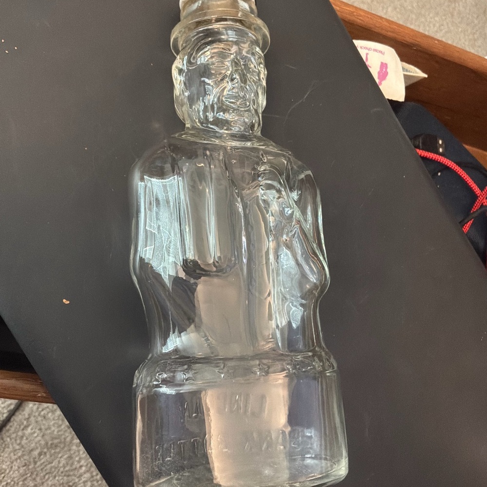 Vintage glass bottle from Lincoln food storage/ bank